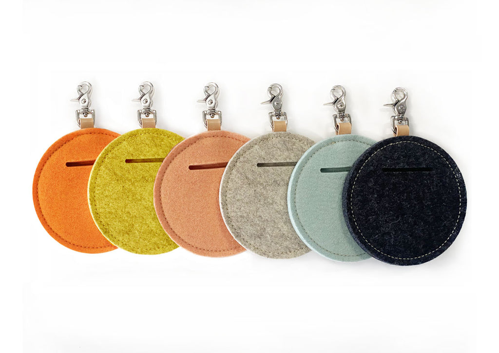 assortment of different colored wool pouches
