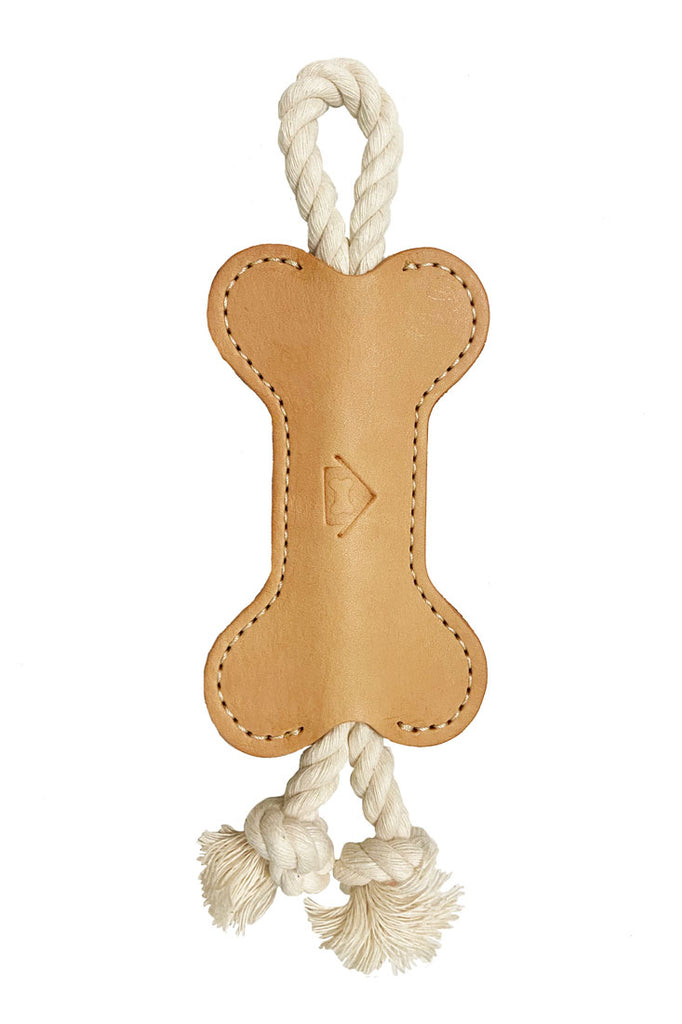 cream white colored vegetable leather tug toy, full view