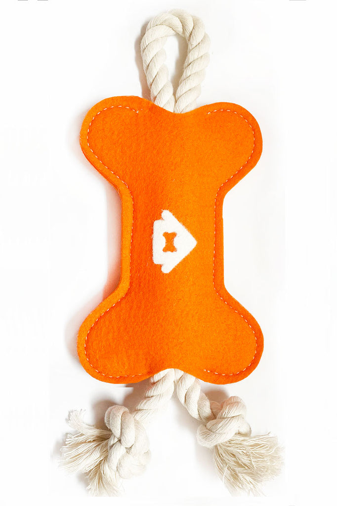 orange colored wool dog toy
