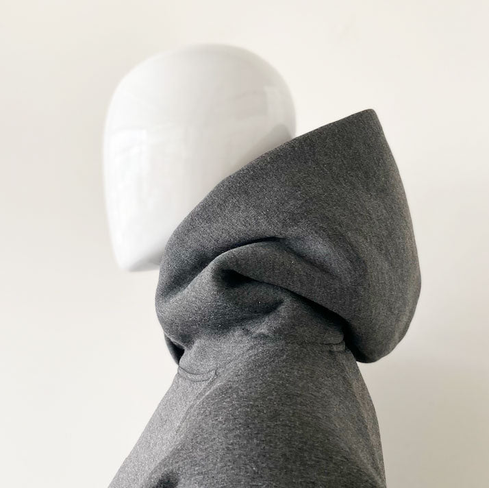 side view of dark grey heather unisex hoodie