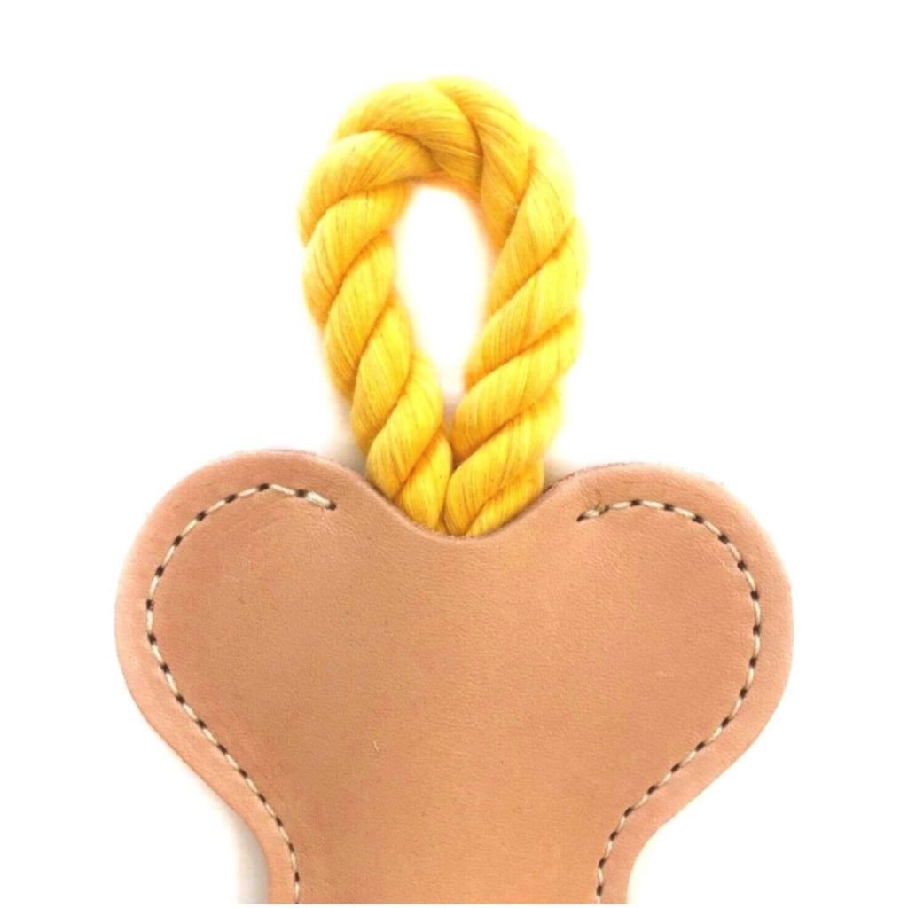 yellow colored vegetable leather tug toy
